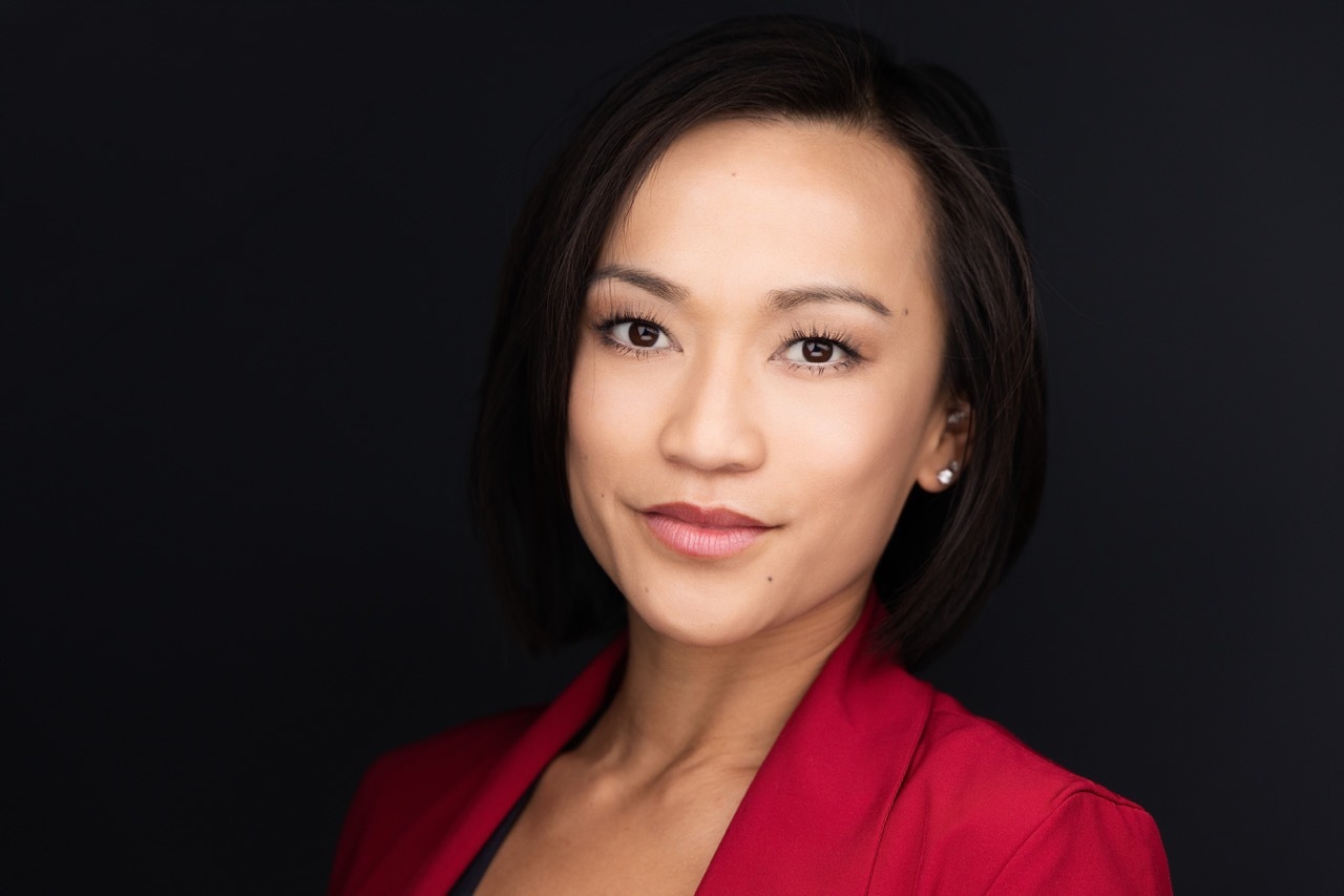 Denver executive business headshot of a woman in a red blazer